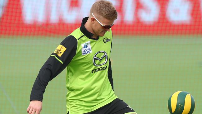 Sam Billings warms up with a soccer ball before a BBL game.