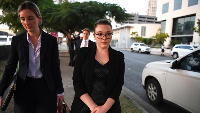 Thunder River Rapids ride operator Courtney Williams (right) leaves the inquest into the Dreamworld disaster at the Magistrates Court at Southport on the Gold Coast, Wednesday, June 20, 2018. Cindy Low, Kate Goodchild, her brother Luke Dorsett and his partner Roozi Araghi all died when Dreamworld's Thunder River Rapids ride malfunctioned in October 2016. (AAP Image/Dan Peled)