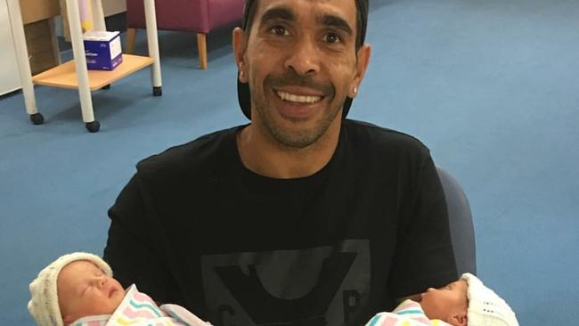 Adelaide Crows forward Eddie Betts with his twin daughters. Picture: Instagram.