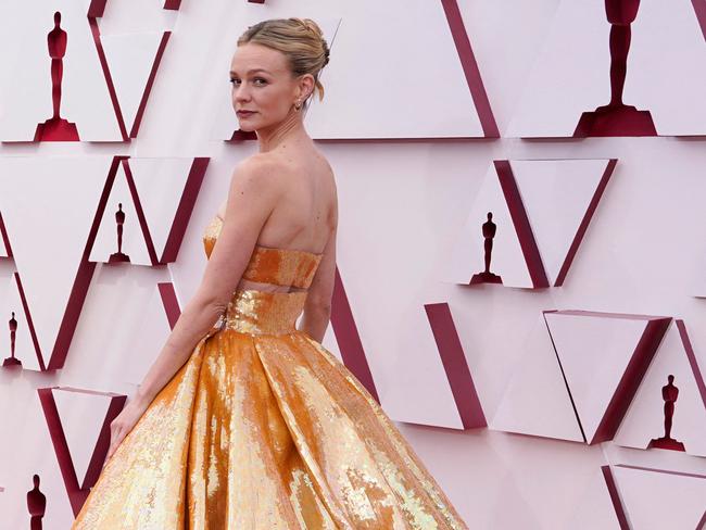 A dramatic entrance by Carey Mulligan, dressed as an actual Oscar. Picture: AFP