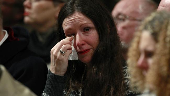 A woman wipes her eye at the 25th remembrance service marking the Lockerbie air disaster anniversary. Picture: Luke MacGregor.