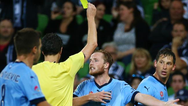 Sydney FC's Rhyan Grant gets a yellow card. Picture: George Salpigtidis