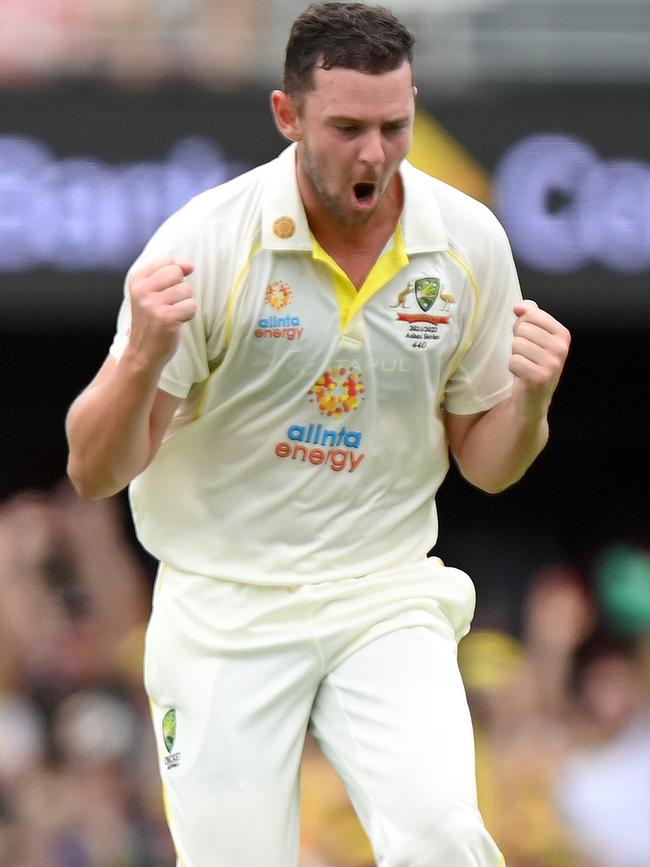 Hazlewood celebrates taking the wicket of Joe Root on the opening day of the First Test.