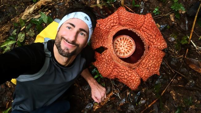 Oxford University botanist and parasitic plant specialist Chris Thorogood with a Rafflesia flower in Western Sumatra in February. Photo: Supplied