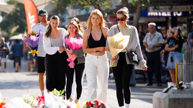 Floral tributes and condolences from members of the public outside Westfield Bondi Junction this morning after the massacre on the weekend. Picture: David Swift