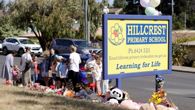 Families and students gather to pay their condolences and lay flowers and toys in memory of the five kids killed. Picture: NCA Newswire / Grant Viney