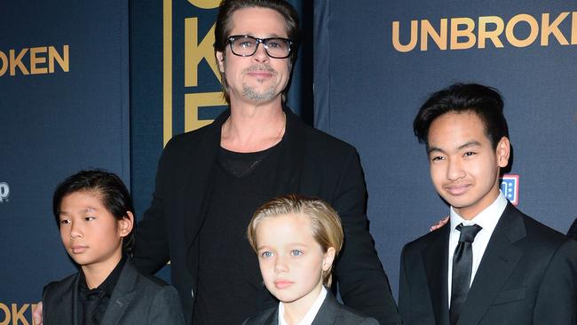 Actor Brad Pitt and children Pax Jolie-Pitt (L), Shiloh Jolie-Pitt (C) and Maddox Jolie-Pitt as at a film premier in 2016.