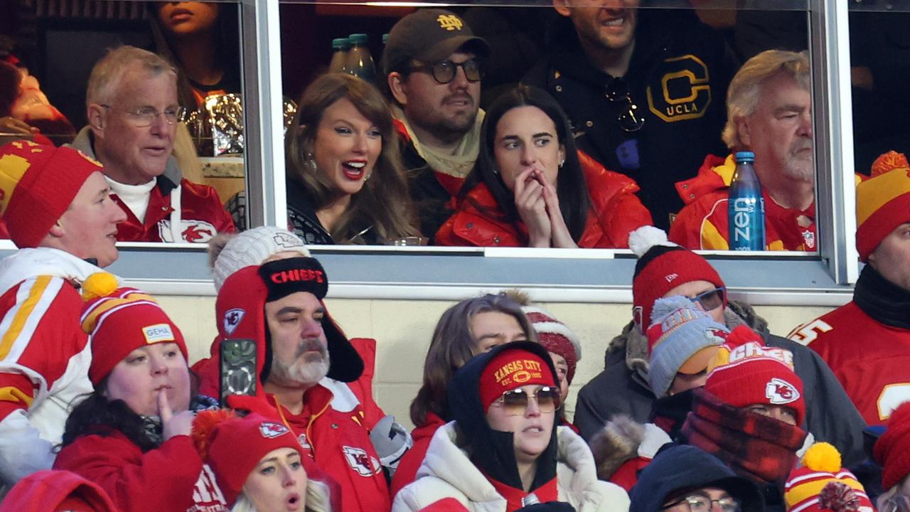 Taylor Swift talks with Caitlin Clark during the AFC Divisional Playoff between the Houston Texans and the Kansas City Chiefs. (Photo by Jamie Squire/Getty Images)