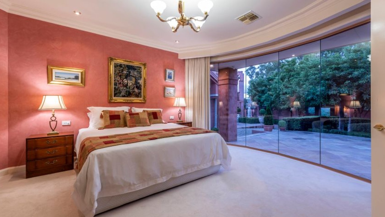 The master bedroom has wall-to-floor windows.