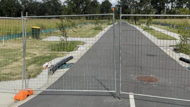 Oracle home and land subdivision at Pallara is locked up behind security fences. Photo: Glen Norris