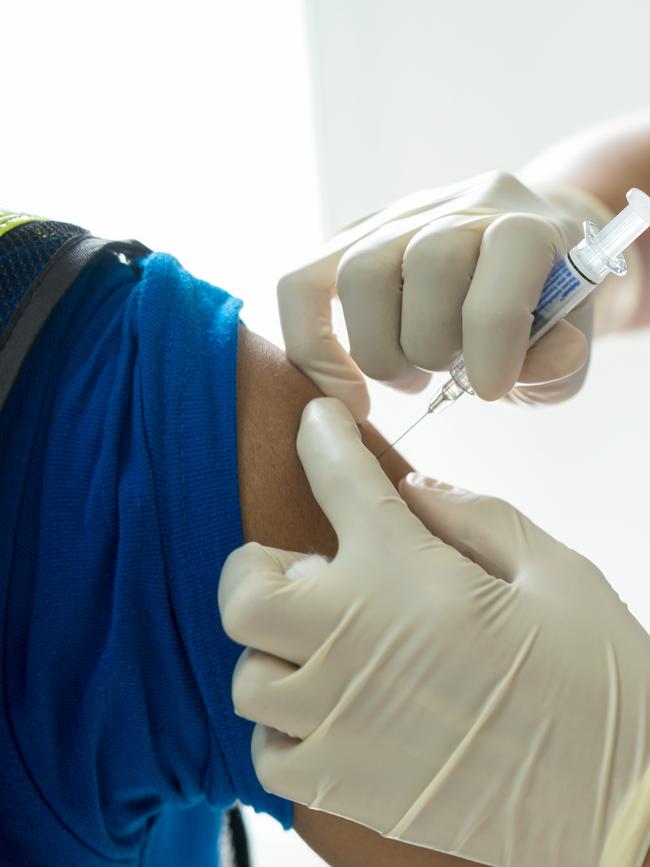 A doctor is giving a flu vaccine. Picture: File