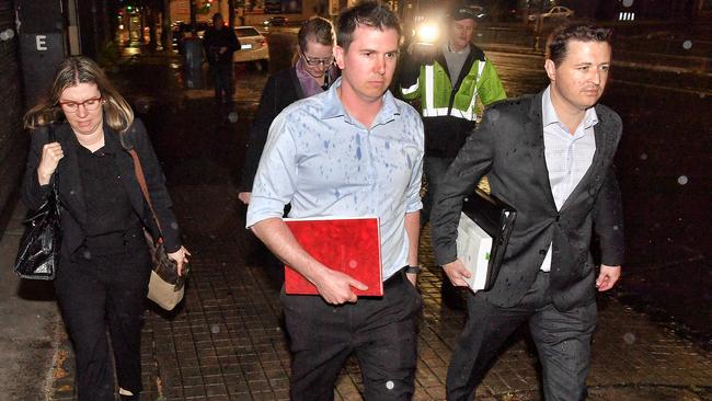 Registered Organisations Commission (ROC) representatives leave the AWU offices on Spencer Street, Melbourne. Picture: Jason Edwards.