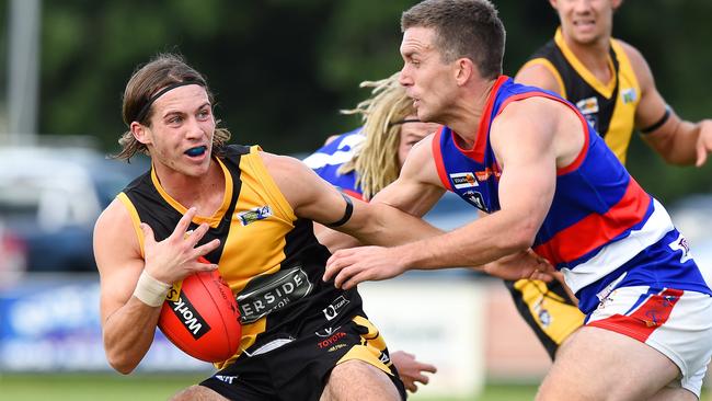 Tom O’Sullivan (left) dodges a tackle from Gisborne’s Clinton Young. Picture: Josie Hayden