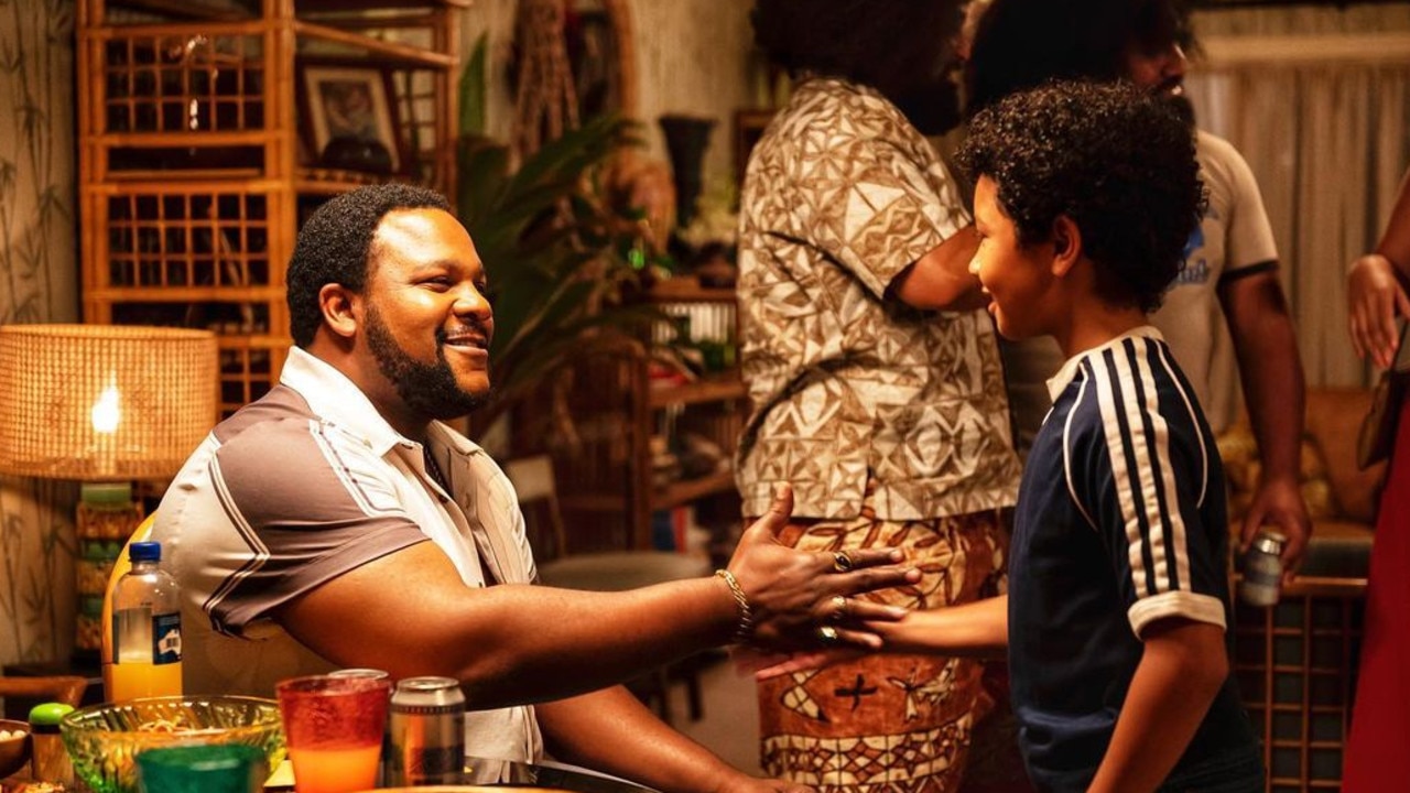 Nate Jackson as The Junkyard Dog with Adrian Groulx as 10-year-old Dwayne Johnson on the Brisbane set of new NBC TV series, Young Rock. Picture: Instagram/ @therock