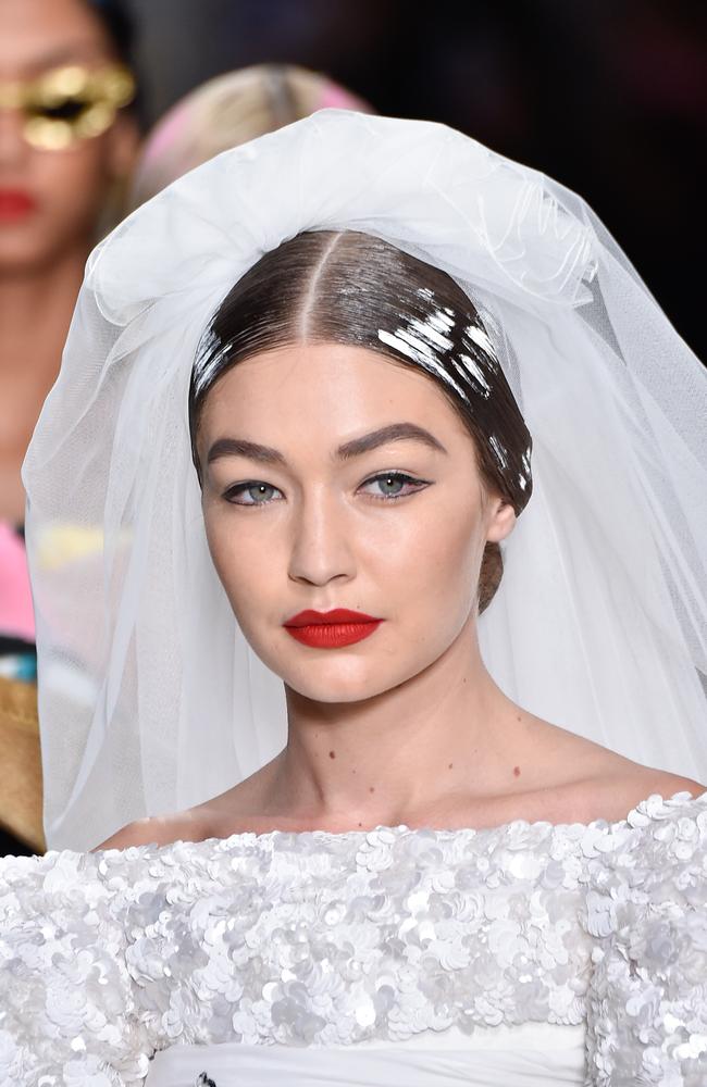 Up close! With red lips by MAC Cosmetics (specifically, Retro Matte Liquid Lip colour in cult red shade). Picture: Getty Images