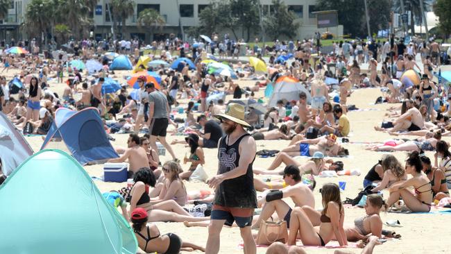 Crowds flocked to St Kilda Beach on the Melbourne Cup Day public holiday to soak up the sun. Picture: NCA NewsWire / Andrew Henshaw