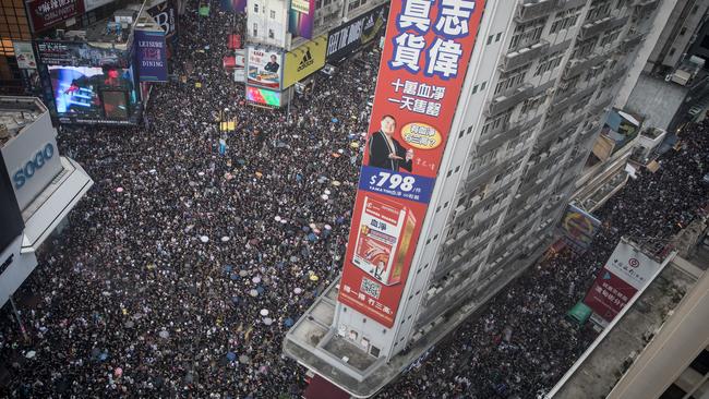 Hundreds of thousands of protesters walk down Hennessay Road during an anti-extradition bill march on July 21. Hong Kong's Chief Executive Carrie Lam has condemned brutal beatings at a subway station which left 45 injured, but also condemned the protesters. Picture: Chris McGrath/Getty