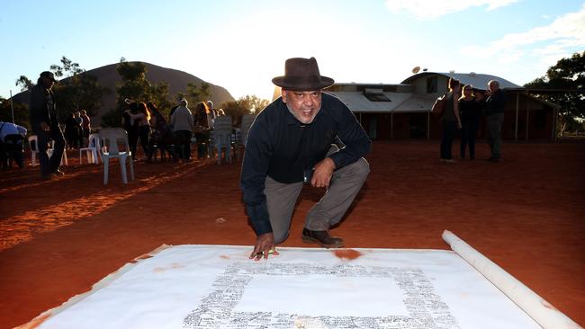 Noel Pearson signs the Uluru Statement from the Heart.