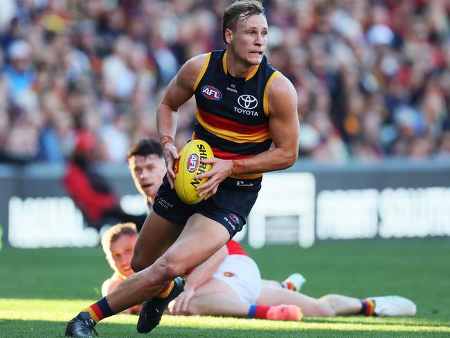 ADELAIDE, AUSTRALIA - MAY 12: Jordan Dawson of the Crows runs with the ball during the 2024 AFL Round 09 match between the Adelaide Crows and the Brisbane Lions at Adelaide Oval on May 12, 2024 in Adelaide, Australia. (Photo by James Elsby/AFL Photos via Getty Images)