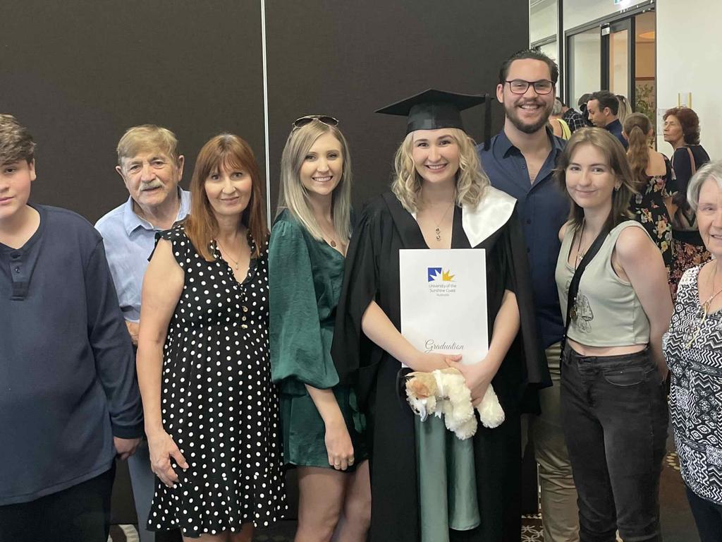 Angela Slade and her family at the University of the Sunshine Coast graduation ceremony at the Beach House Hotel on October 12, 2023.