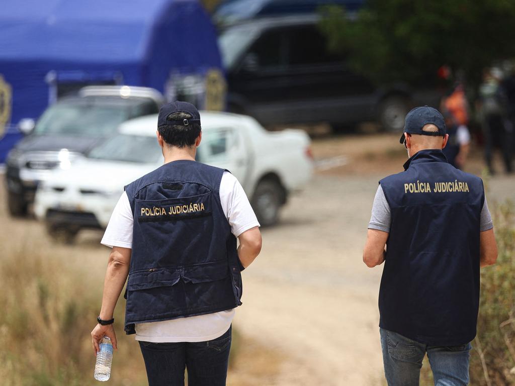 Portuguese authorities from the Judicial Police criminal investigation unit work during a new search operation amid the investigation into the disappearance of Madeleine McCann (Maddie) at the Arade dam. (Photo by FILIPE AMORIM / AFP)