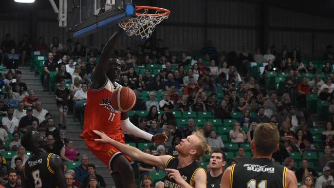 Emmanuel Malou throws down a dunk for Mackay Meteors. Picture: Matthew Forrest