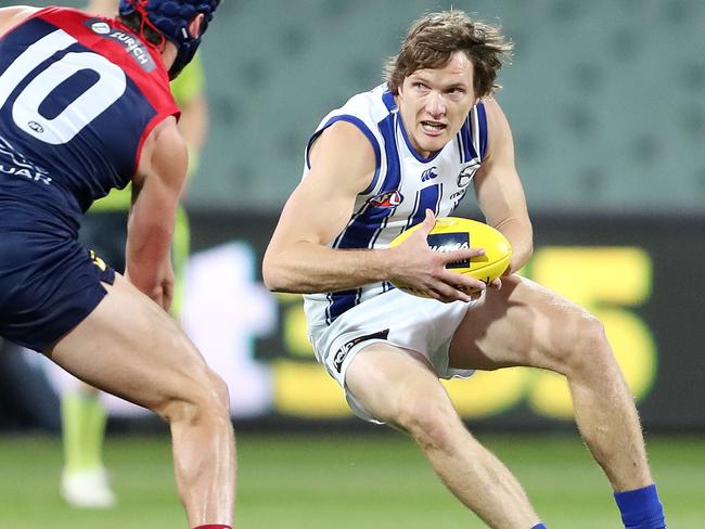 AFL - Sunday, 9th August, 2020 - Melbourne v North Melbourne at the Adelaide Oval. North Melbourne's Jared Polec and Melbourne's Angus Brayshaw  Picture: Sarah Reed