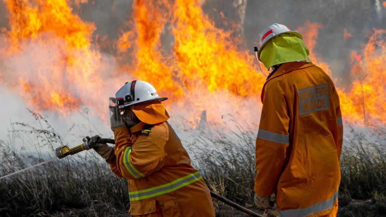 The Queensland Rural Fire Service in action. Picture: Dominic Elsome