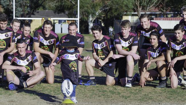 The Hills Bulls U16 rugby league team with Eli attempting to kick the ball. Picture: Nicoline Kronast