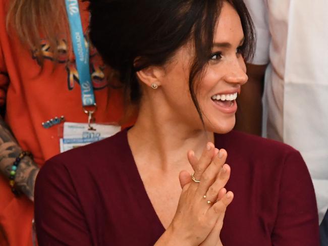 Britain's Prince Harry, Duke of Sussex (R) and Meghan, Duchess of Sussex (L) attend a roundtable discussion on gender equality with The Queen’s Commonwealth Trust (QCT) and One Young World at Windsor Castle in Windsor on October 25, 2019. (Photo by Jeremy Selwyn / POOL / AFP)