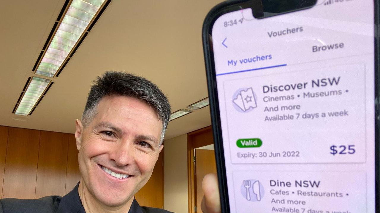 Digital and Customer Service Minister Victor Dominello with the NSW Government's Service NSW app showing the Dine &amp; Discover vouchers. Source: LinkedIn