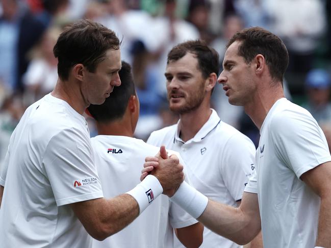 LONDON, ENGLAND - JULY 04: Rinky Hijikata and John Peers of Australia shake hands with Andy Murray and Jamie Murray of Great Britain at the net following victory in the GentlemenÃ¢â¬â¢s Doubles first round match during day four of The Championships Wimbledon 2024 at All England Lawn Tennis and Croquet Club on July 04, 2024 in London, England. (Photo by Francois Nel/Getty Images)