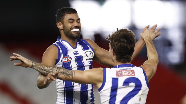 Tarryn Thomas celebrates a goal with new co-captain Jy Simpkin.