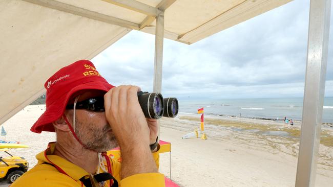 Lifesavers on the job - patrol captain Rob Moffat on Burleigh Beach after shark sighting closed beaches. Picture Mike Batterham