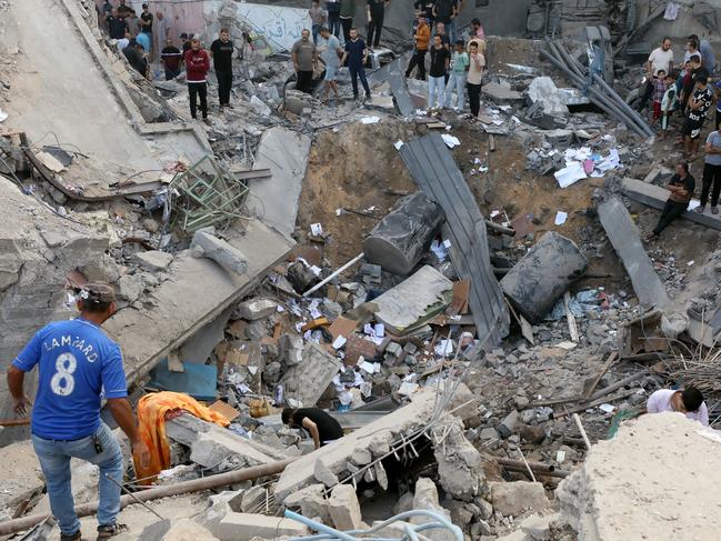 Palestinians search the destroyed annex of the Greek Orthodox Saint Porphyrius Church, the oldest church still in use in Gaza, damaged in a strike on Gaza City. Picture: AFP