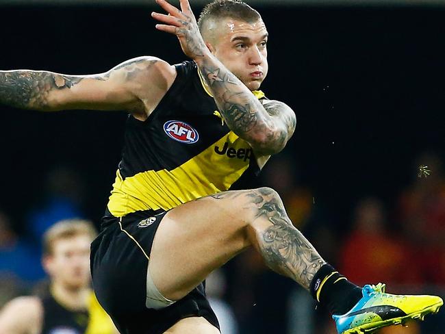 GOLD COAST, QUEENSLAND - JULY 29:  Dustin Martin of the tigers kicks the ball during the round 19 AFL match between the Gold Coast Suns and the Richmond Tigers at Metricon Stadium on July 29, 2017 in Gold Coast, Australia.  (Photo by Jason O'Brien/AFL Media/Getty Images)