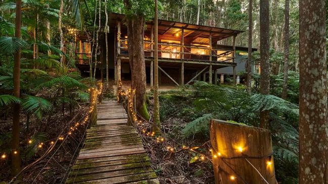 Feel like you’re in a movie with a fantastical entrance complete with fairy lights and surrounded by nature. Picture: Airbnb