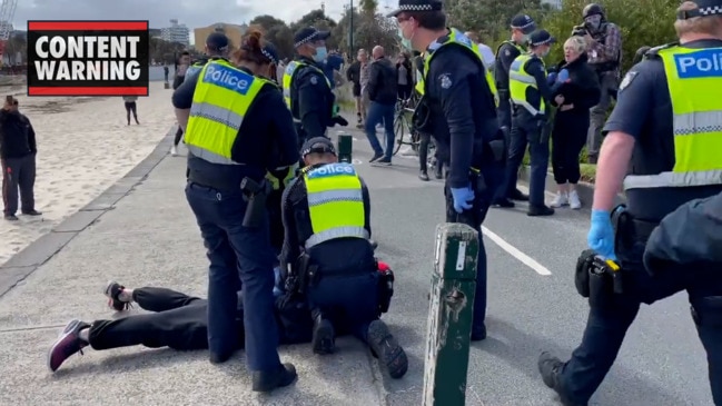 Police arrest anti-vax protesters on the St Kilda foreshore in Melbourne