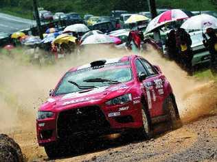 Rally driver Katsu Taguchi says he’s “a little worried” ahead of this weekend’s rally in the forests around Imbil. He is pictured in action in his Mitsubishi Lancer. Picture: Contributed