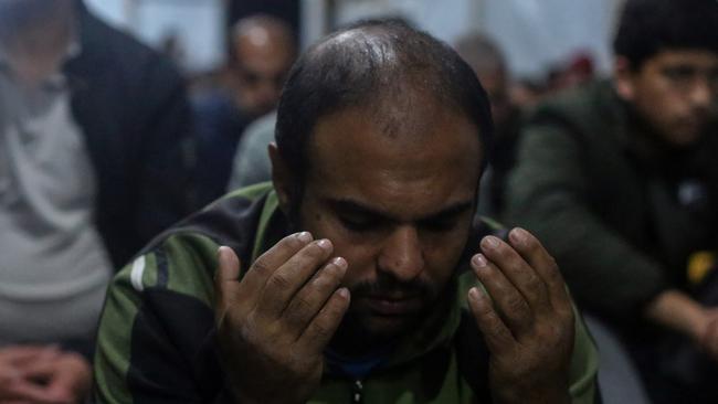 Palestinians celebrate Laylat al-Qadr on the ruins of the Al-Farouq Mosque in Rafah this week. Picture: Getty Images