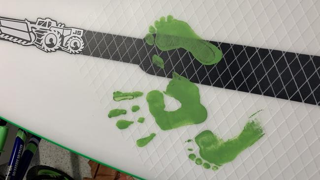 Julian Wilson’s boards feature his children Olivia and River’s footprints and wife Ashley’s handprint. Photo: Supplied