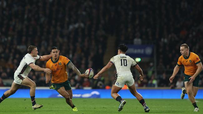 Len Ikitau puts Max Jorgensen into the corner to score. Photo by Adrian Dennis / AFP.