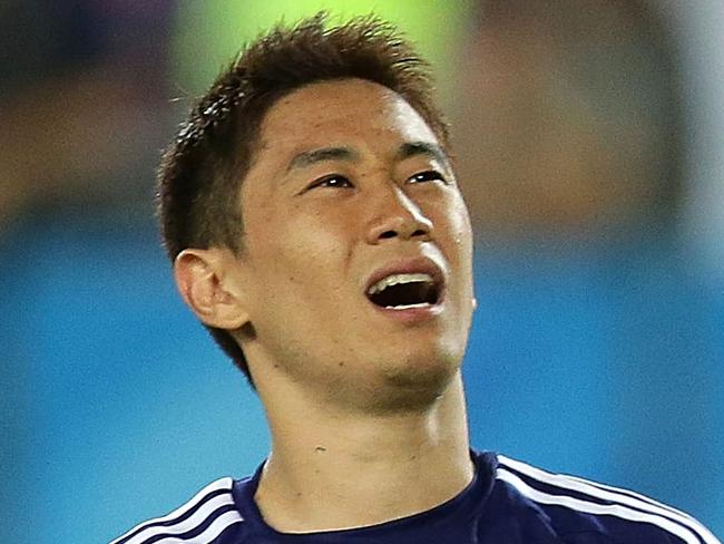 SYDNEY, AUSTRALIA - JANUARY 23: Shinji Kagawa of Japan reacts to missing a penalty during the 2015 Asian Cup Quarter Final match between Japan and the United Arab Emirates at ANZ Stadium on January 23, 2015 in Sydney, Australia. (Photo by Mark Metcalfe/Getty Images)