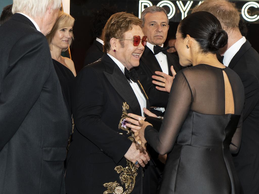 Elton John with Harry and Meghan at the Lion King premiere in July. Picture: Getty Images