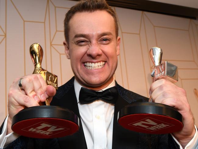 Grant Denyer, presenter of Family Feud, poses with his Gold Logie award (left) at the 2018 Logie Awards at The Star Casino on the Gold Coast, Sunday, July 1, 2018. (AAP Image/Dan Peled) NO ARCHIVING, EDITORIAL USE ONLY