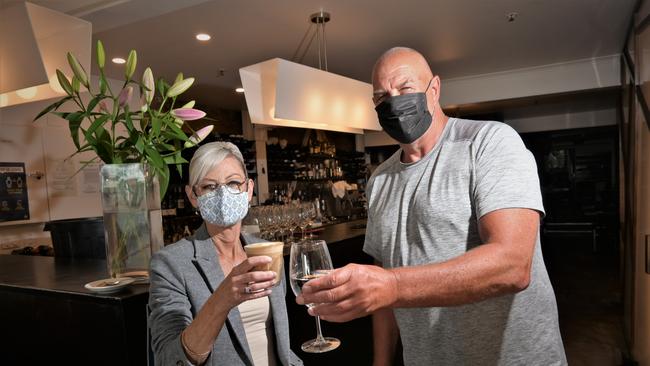 TOAST: Attorney general Elise Archer and Rockwall Bar and Grill owner Garry Baker. Picture: Kenji Sato