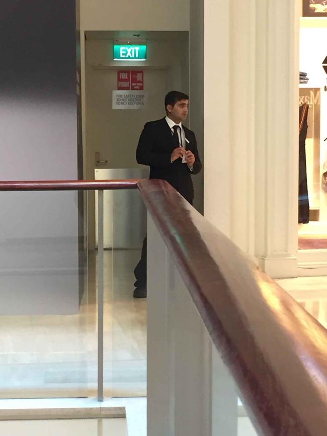 Security staff guard the entrance of the stairwell where Bernard Gore was found dead at Westfield Bondi Junction.