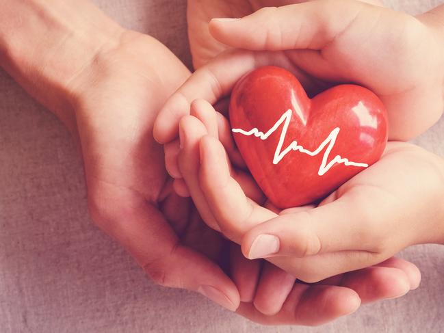 Health insurance, child and woman holding a heart. Picture: iStock.