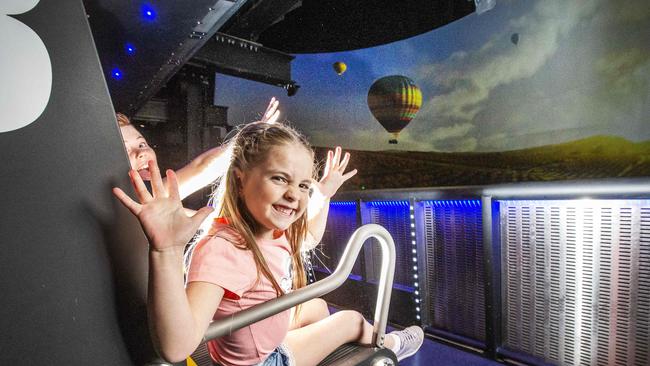 Dreamworld. Lola, 7(front) and Hugo Lange, 9 from Brisbane on Dreamworld's new ride the Sky Voyager which opens today. Picture: NIGEL HALLETT