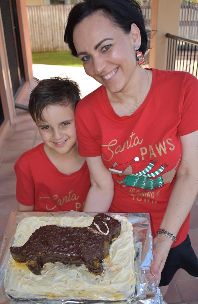 Party organiser Monika Zakal baked a dachshund cake with the help of her son Matthew, 9, for the Mackay Dachshunds Christmas Party. Photo: Janessa Ekert